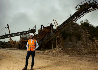 Suttles’ Director, John Suttle, in front of the stone crusher at Swanworth Quarry