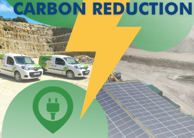 Suttles Carbon Reduction Strategy. Two Electric Vehicles shown in the bottom of an aggregate quarry